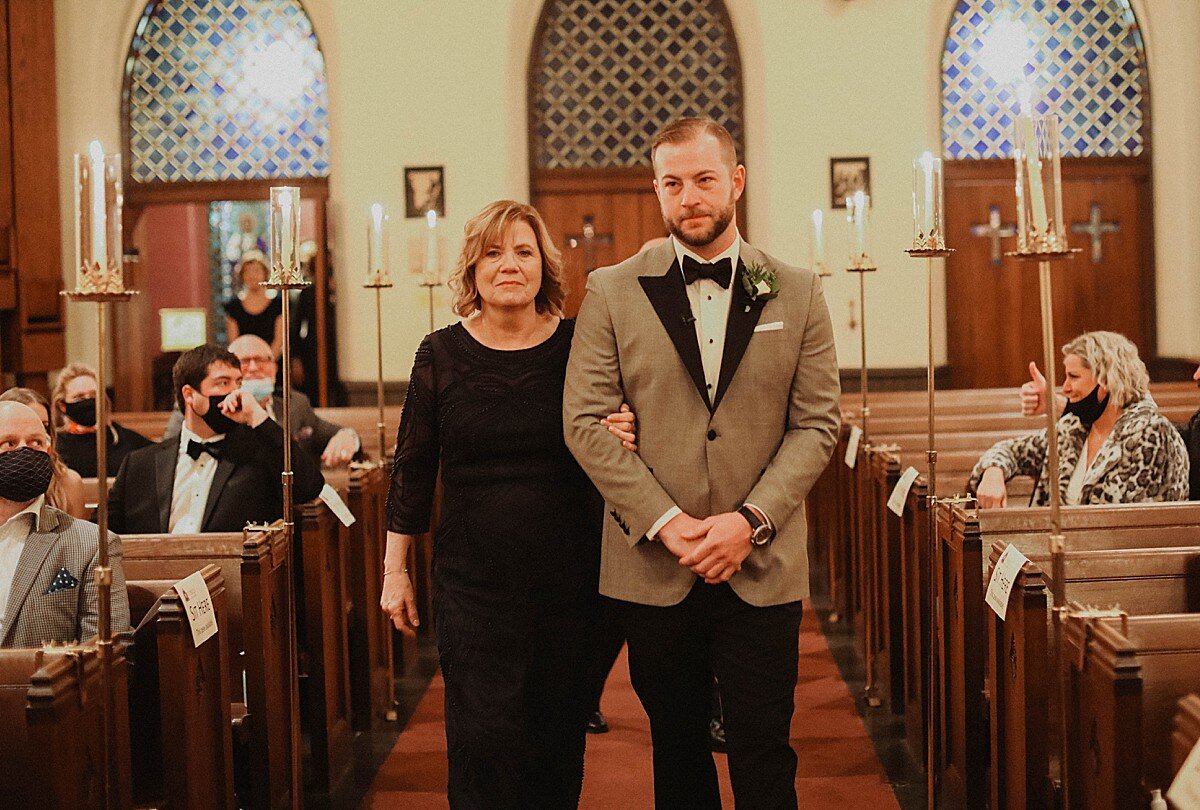 groom-and-mom-down-aisle.jpg